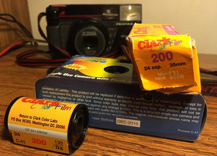 Two film cameras and an expired roll of 35mm